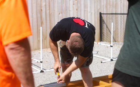 Person putting together agility equipment